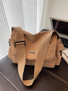 Khaki nylon crossbody tote bag with adjustable strap and YOU JI BEAR logo for office