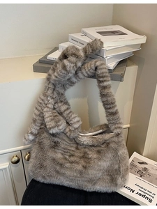 Brown striped faux fur tote bag with knotted handle and elegant casual plush design