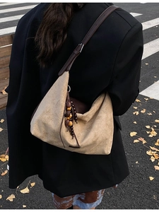 Retro khaki suede tote bag with brown leather straps and beaded charm for daily commute