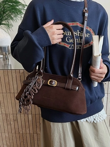 Retro dark brown frosted leather shoulder bag with buckle and woven pendant charm