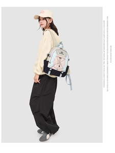 Fashionable outdoor backpack detail with multi-color paneling and adjustable side buckles