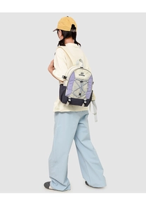 Detail of multi-color hiking backpack with bungee cord and durable nylon texture