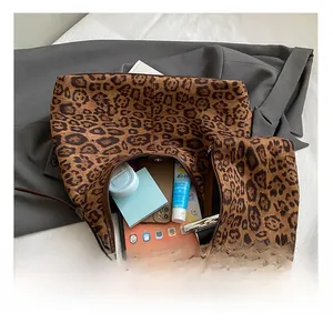 Spacious leopard print tote bag interior showing capacity for tablet and phone