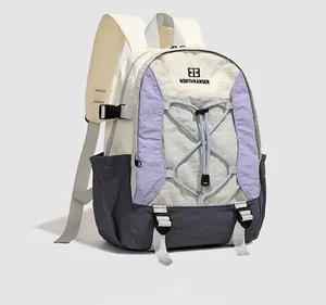 Macro shot of tricolor lightweight nylon outdoor backpack with elastic drawstring and mesh straps