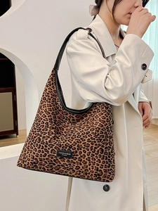 Mini leopard print crossbody bag with black leather strap and chic square hobo design