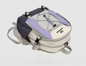 Detail of multi-color outdoor backpack with adjustable buckles and elastic cord system