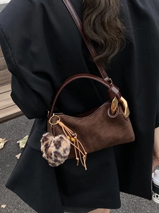 Retro brown suede crossbody bag with gold chain strap and leopard print heart charm