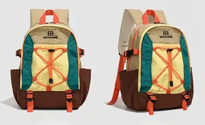Front and side view of waterproof color-block outdoor backpack with bungee cord details
