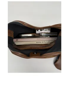 Top view showing spacious interior with zipper pocket and magnetic closure of suede bag