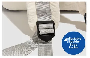 Macro detail of widened quilted white shoulder straps with adjustable buckle on backpack