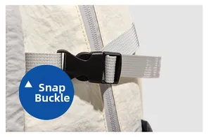 Detail view of the durable black plastic buckle and grey nylon webbing on the hiking backpack