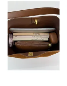 Detailed interior view of a spacious suede bucket bag showing large storage capacity