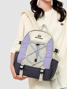 Large beige and purple outdoor hiking backpack with NORTHHANSER brand and bungee cords