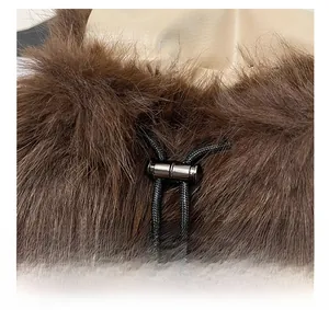 Close-up of adjustable drawstring with metal toggle on dark brown plush backpack