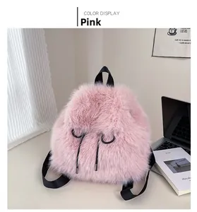 Detailed view of pink plush faux fur backpack with black straps in lifestyle setting