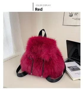 Detailed plush texture of the rose red faux fur backpack with black drawstring accents