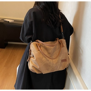 Brown vintage faux denim tote bag with leather texture and detachable shoulder strap