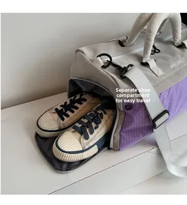 Detail view of large travel bag showing dedicated side shoe compartment with canvas shoes