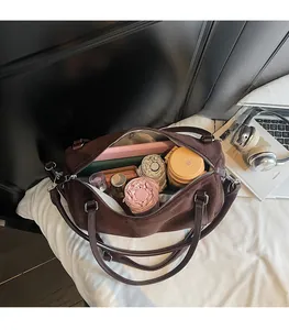Top-down view of spacious dark brown suede tote bag showing large interior capacity