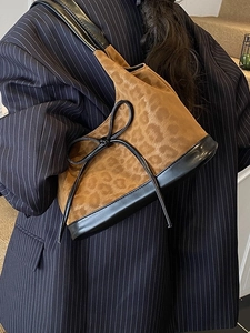 Leopard print underarm shoulder bag for women with black leather trim and bow detail