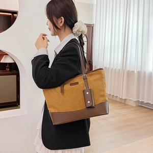 Detail of vintage leopard large tote bag with dark brown leather straps and small pouch