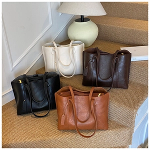 Detailed comparison of large tote bags in white, dark coffee, black and brown leather