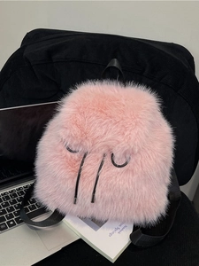 Pink faux fur backpack with black drawstring and adjustable straps for casual winter fashion