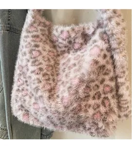 Close-up of soft plush tote bag featuring a pink and brown leopard print texture