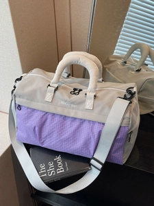 Large capacity waterproof travel bag with purple plaid design and adjustable shoulder strap