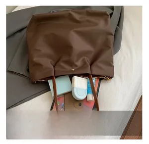 Top view of spacious tote bag interior showing large capacity for gadgets and cosmetics