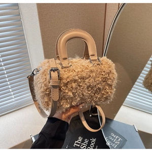 Detail of soft apricot plush crossbody bag with PU leather handle and silver metal hardware
