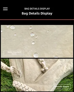 Detail showing water-repellent nylon fabric with smooth zipper and woven rope handle