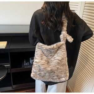 Detail of the soft faux fur texture and tiger pattern on this large shoulder tote bag