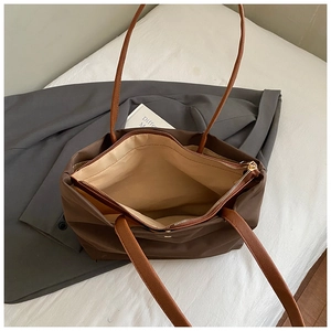 Brown large capacity tote bag with lychee texture handles and zipper closure for work