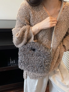 Chic grey faux shearling plush crossbody bag with leather strap for autumn and winter outfits