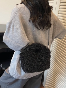 Chic black plush crossbody small square bag for women in a cozy autumn winter outfit