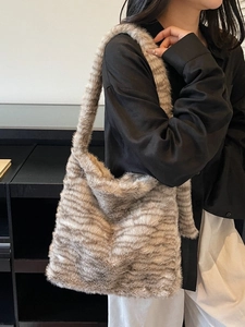 Faux fur large tiger stripe tote bag with fluffy texture and wide shoulder strap