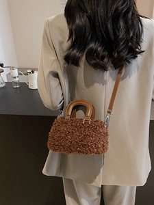 Brown faux shearling square crossbody bag with leather handles and silver hardware for women