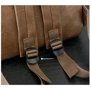 Detail of adjustable nylon shoulder straps on brown vintage leather backpack