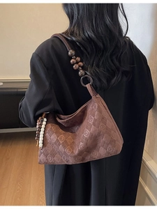 Vintage brown quilted shoulder bag with wooden beads and embossed diamond patterns