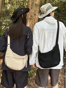 Minimalist nylon crescent crossbody bag for outdoor hiking in cream and black colors