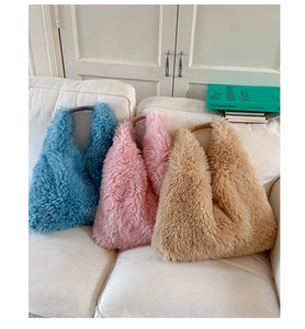 Detailed plush tote bag display in blue, pink, and beige with soft faux fur texture