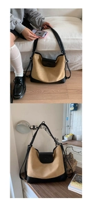 Large tote bag detail showing leather patchwork and magnetic flap closure in daily use
