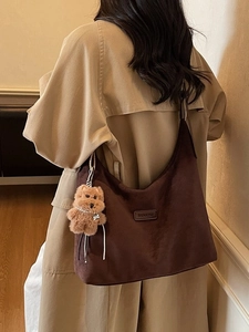 Large dark brown suede tote bag for women featuring a cute plush bear pendant