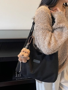 Large capacity black suede tote bag with cute puppy pendant for stylish daily commuting