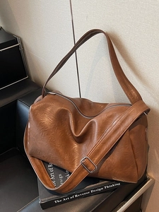 Vintage large brown faux leather tote bag with adjustable shoulder strap for women