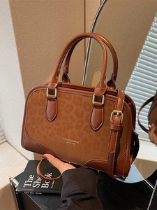 Brown frosted leopard texture tote bag with leather handles and gold fashion logo