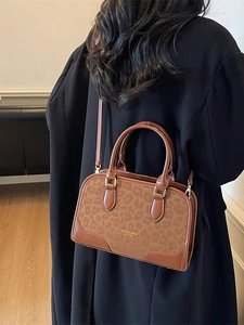 Brown leopard print leather tote bag with fashion lettering and gold metal accents