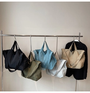 Selection of colorful nylon tote bags with top handles and adjustable shoulder straps