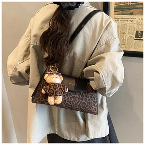 Brown leopard print shoulder bag with black leather flap and cute bear pendant charm